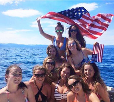 Participants on a boat with the American flag