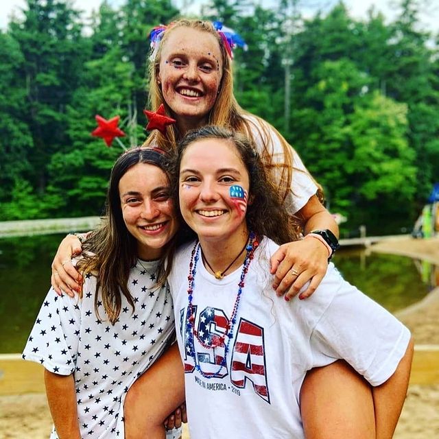 3 camp counselors in USA attire